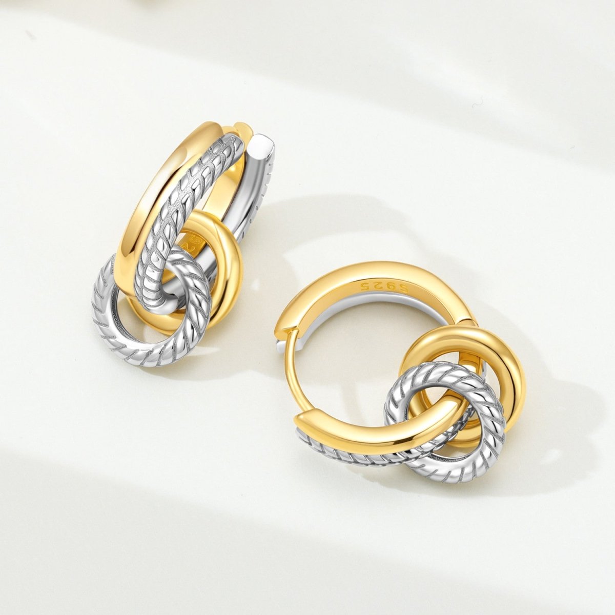 Golden Interlocking Two-Tone Hoop Earrings